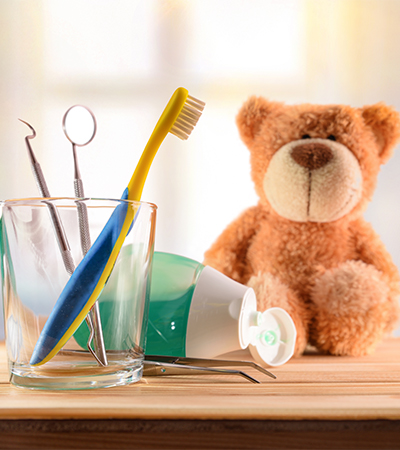 Desk with bear and tooth brush and cleaning tools